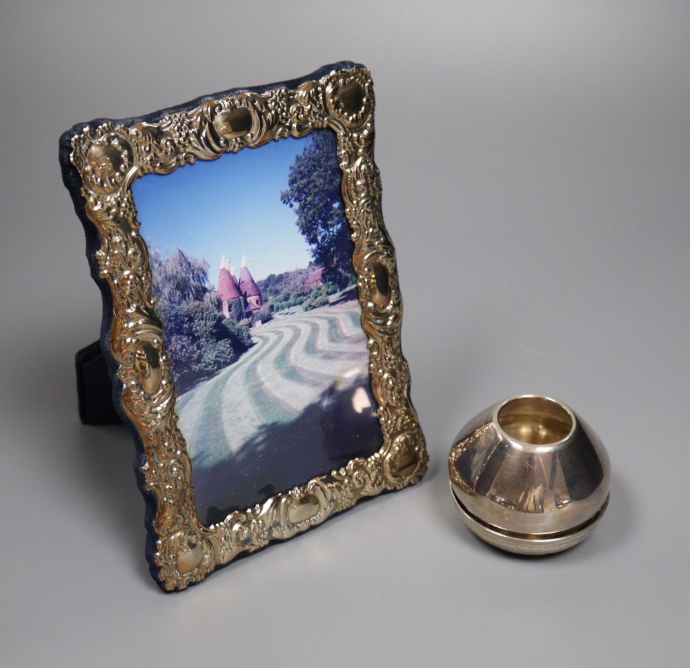 A small Persian white metal dish with inset coin, 67mm, a sterling small vase and a modern silver photograph frame.